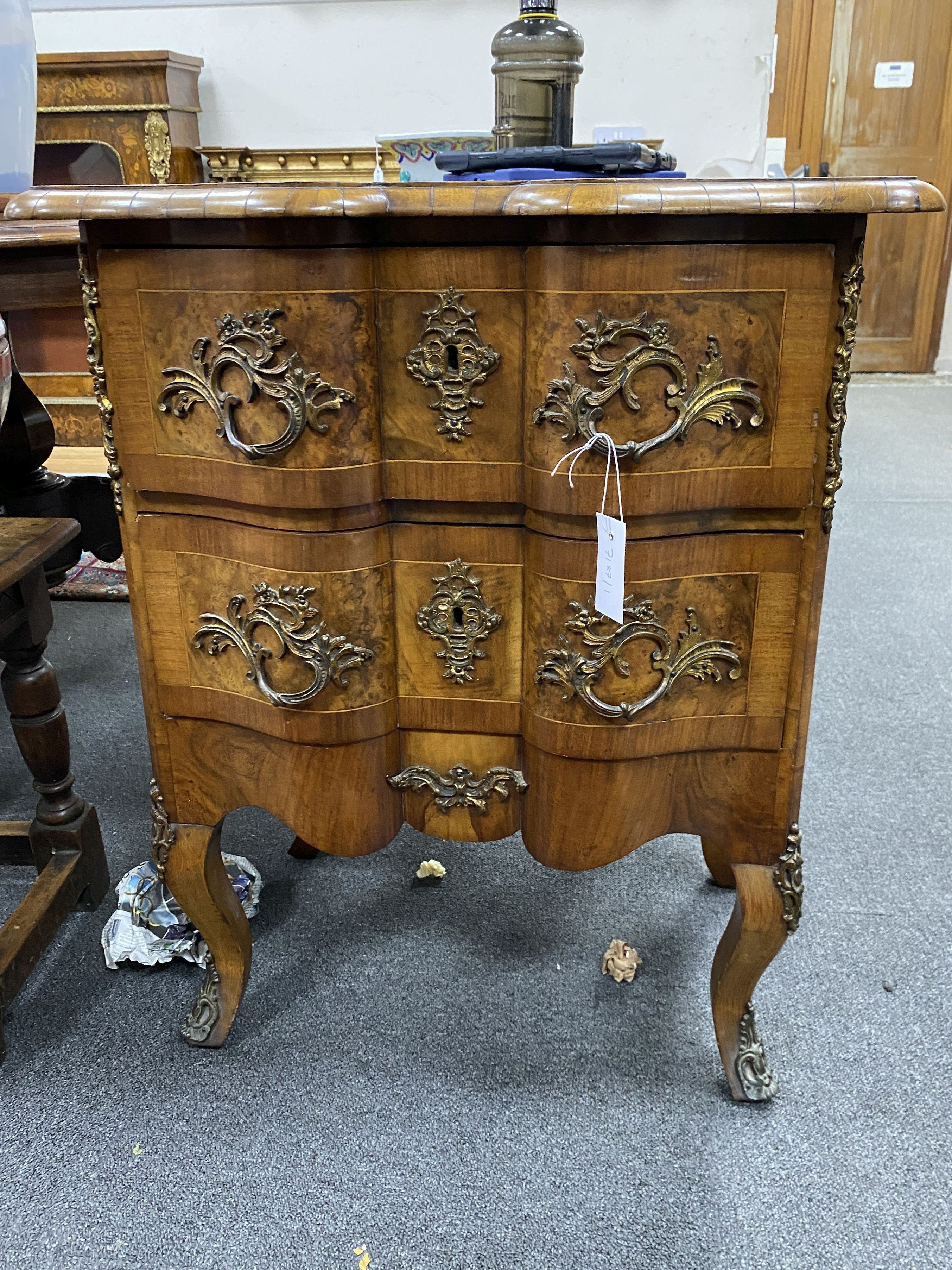 An early 20th century French gilt metal mounted walnut petit commode, width 62cm, depth 44cm, height 76cm